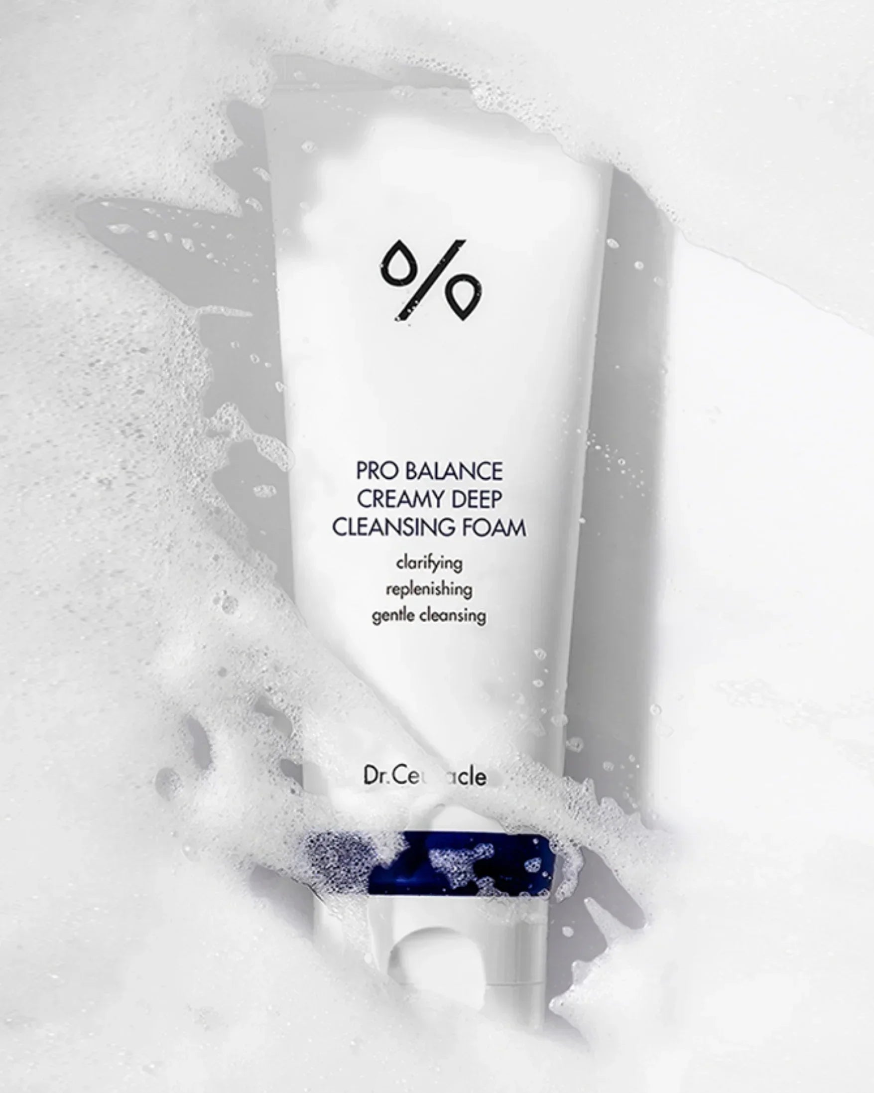 Dr. Ceuracle Pro Balance Creamy Deep Cleansing Foam tube surrounded by white foamy bubbles