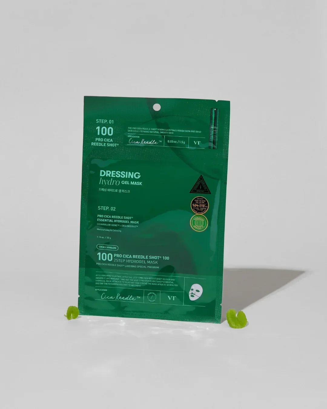 Green packaging of VT Pro Cica Reedle Shot 100 2-Step Hydrogel Face Mask on white background