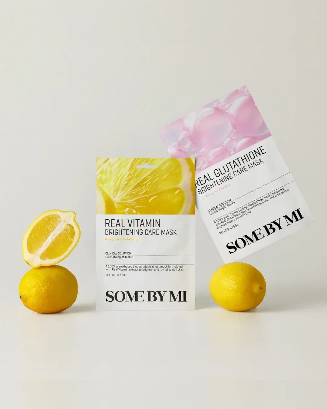 SOME BY MI Brightening Care Masks with Real Vitamin and Glutathione packaging displayed with fresh lemons on a white background