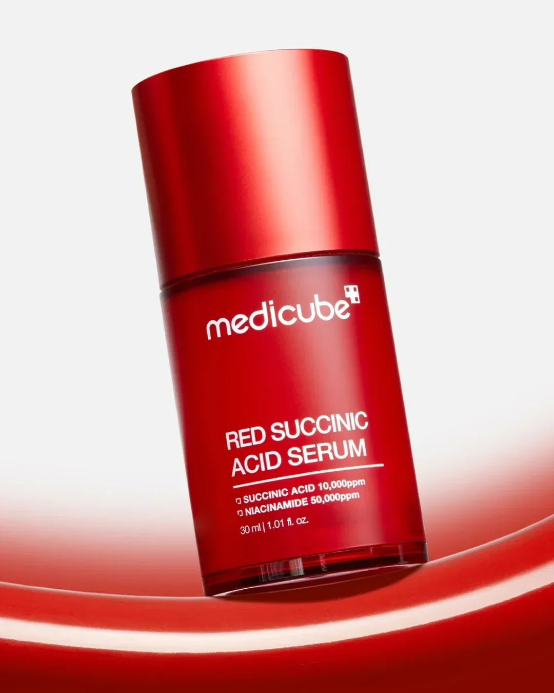 Medicube Red Succinic Acid Serum 30ml bottle on red and white background