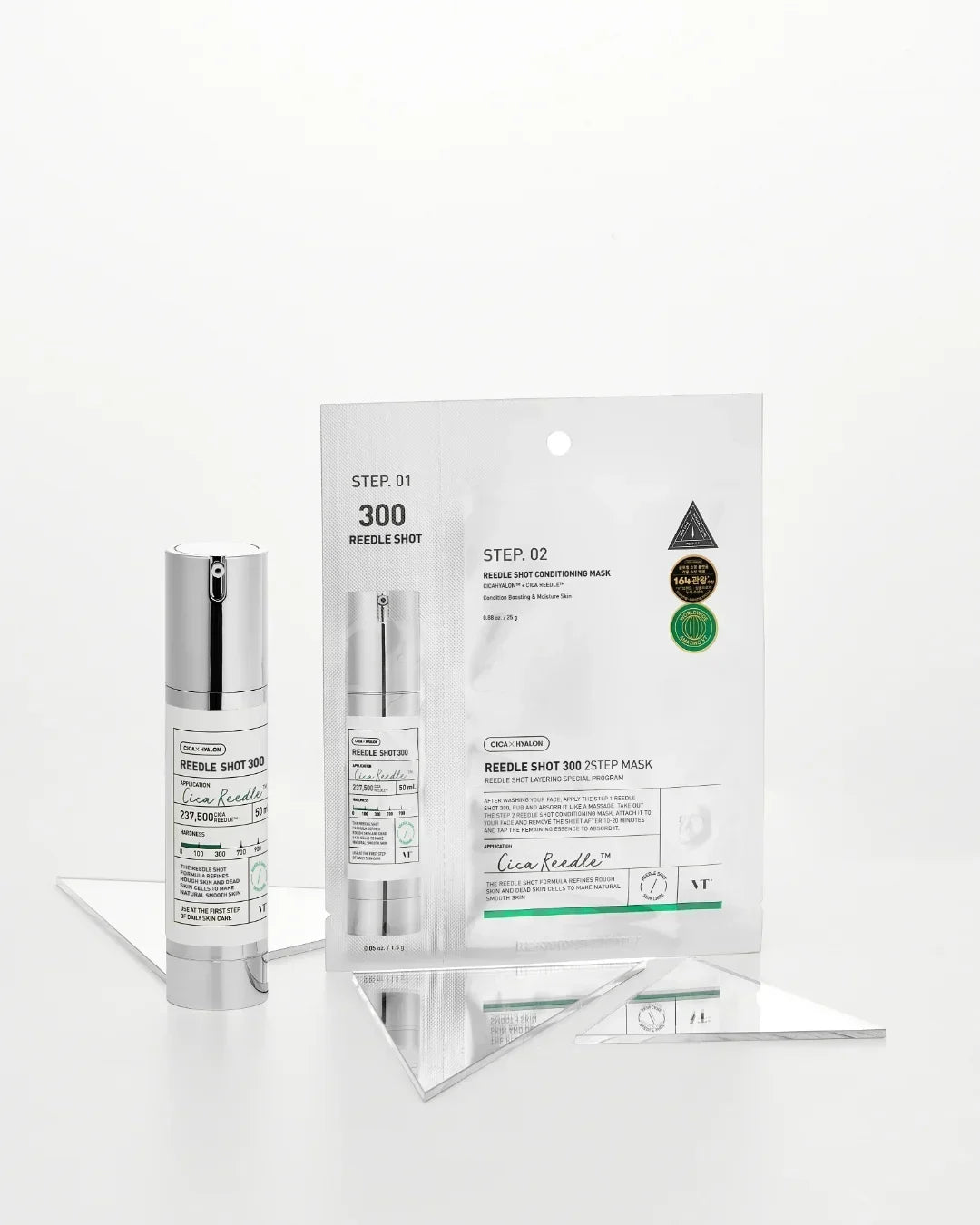 VT Cica Reedle Shot 300 serum and 2-step conditioning mask on reflective white surface