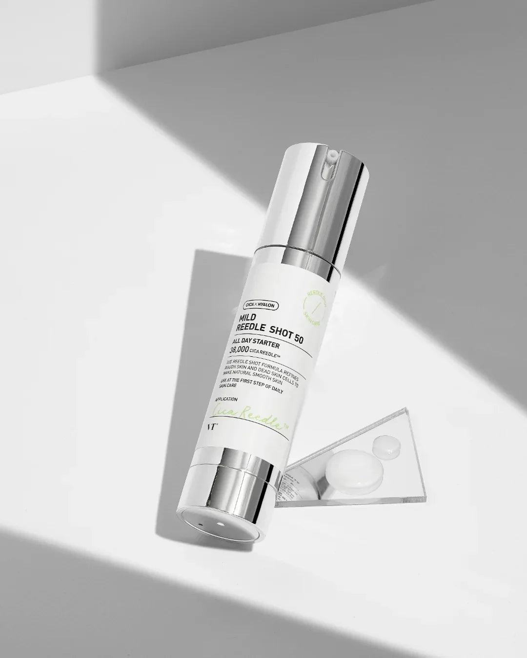 Mild Reedle Shot 50 skincare serum bottle with silver pump on white surface under soft light