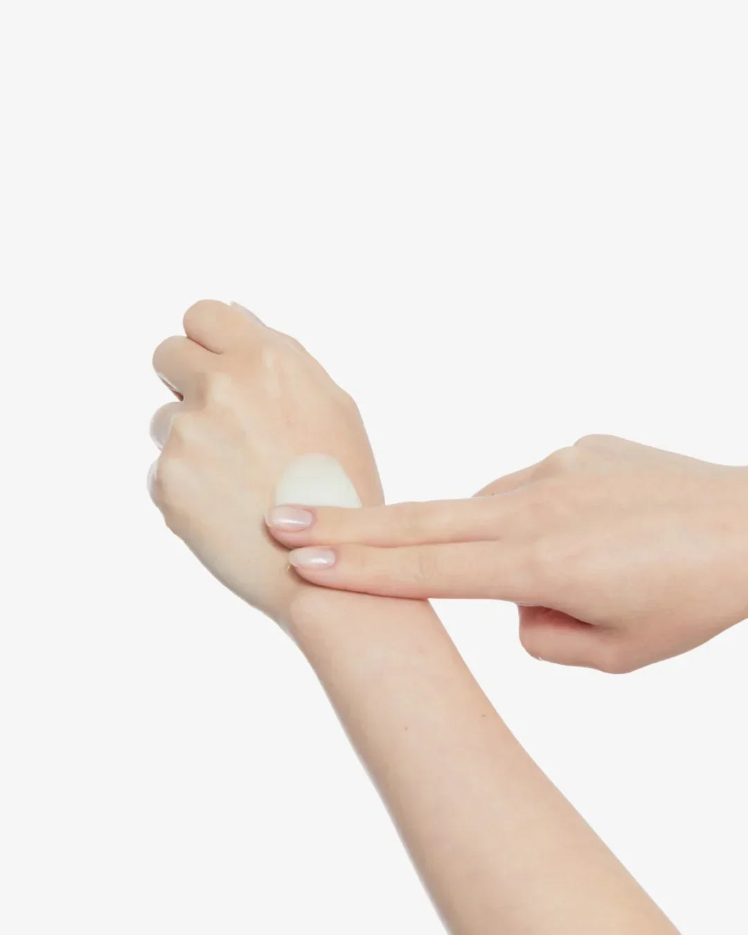 Close-up of hand applying clear gel skincare product onto the back of another hand on white background