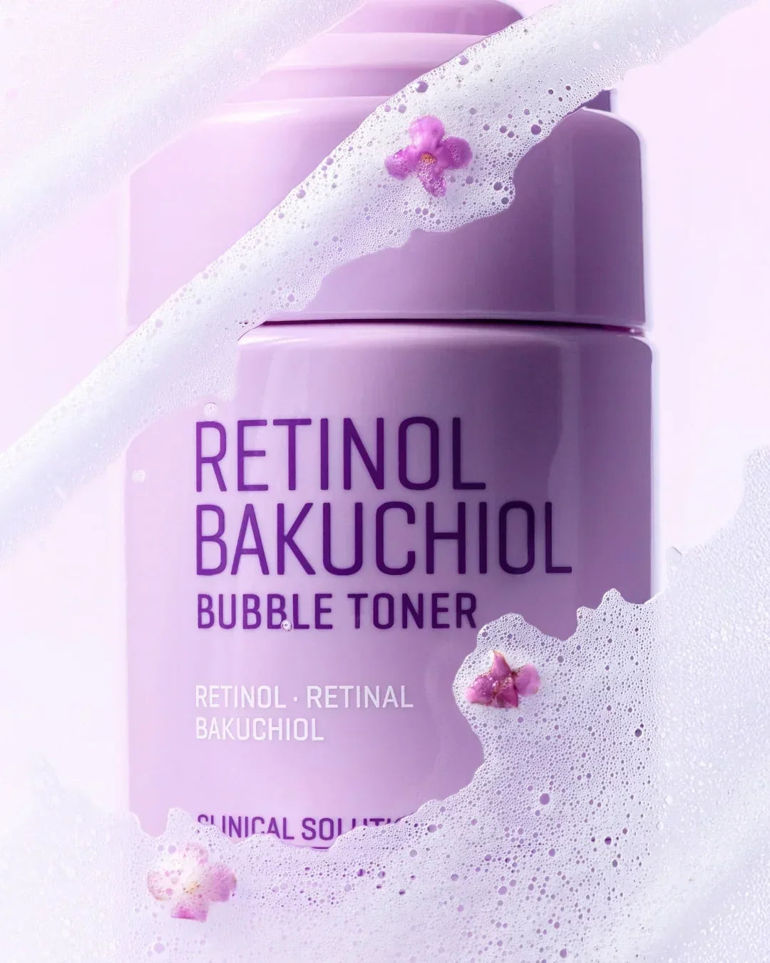 Purple bottle of Retinol Bakuchiol Bubble Toner with foamy bubbles and small purple flowers