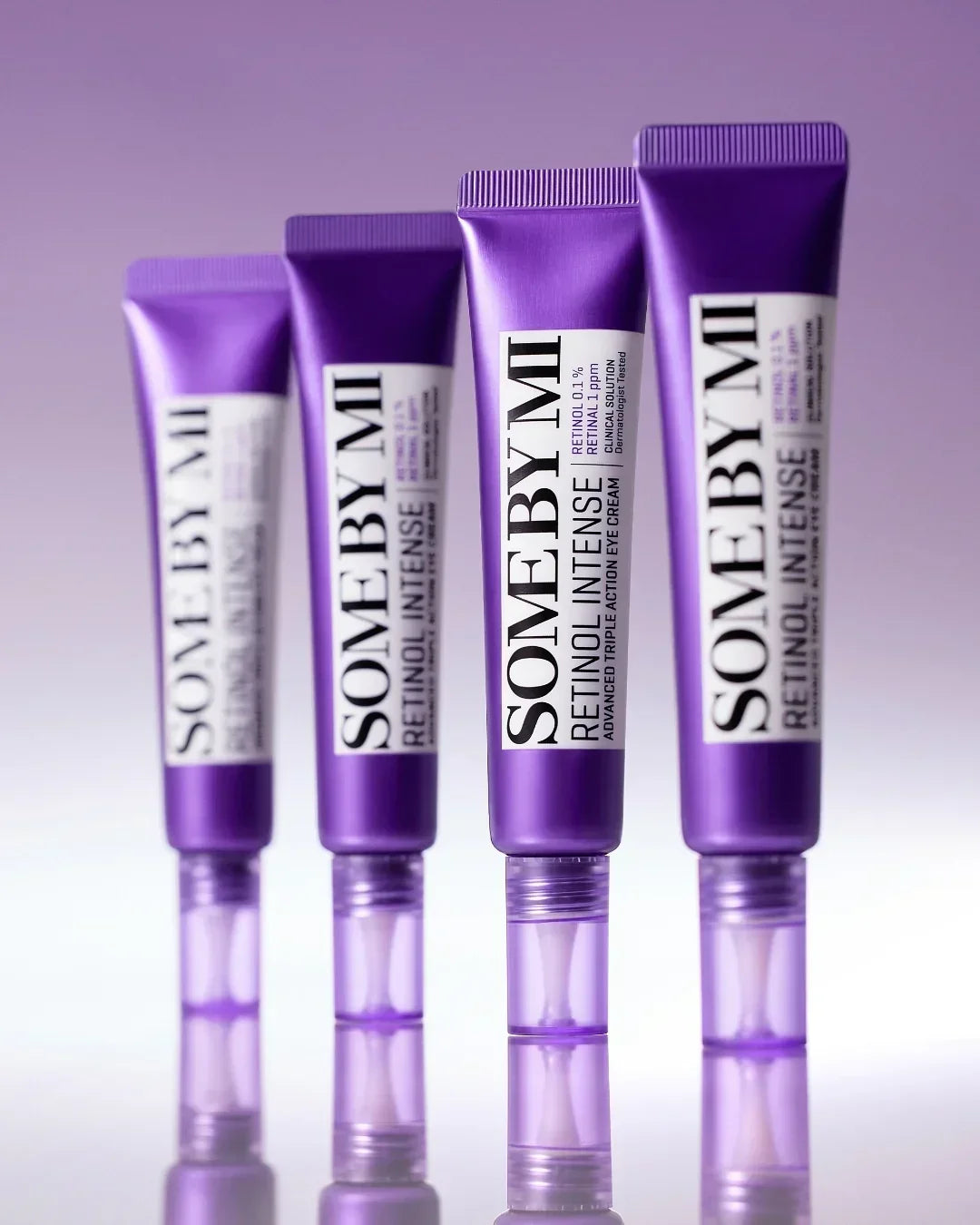 Four purple tubes of SOME BY MI Retinol Intense advanced triple action eye cream on purple background