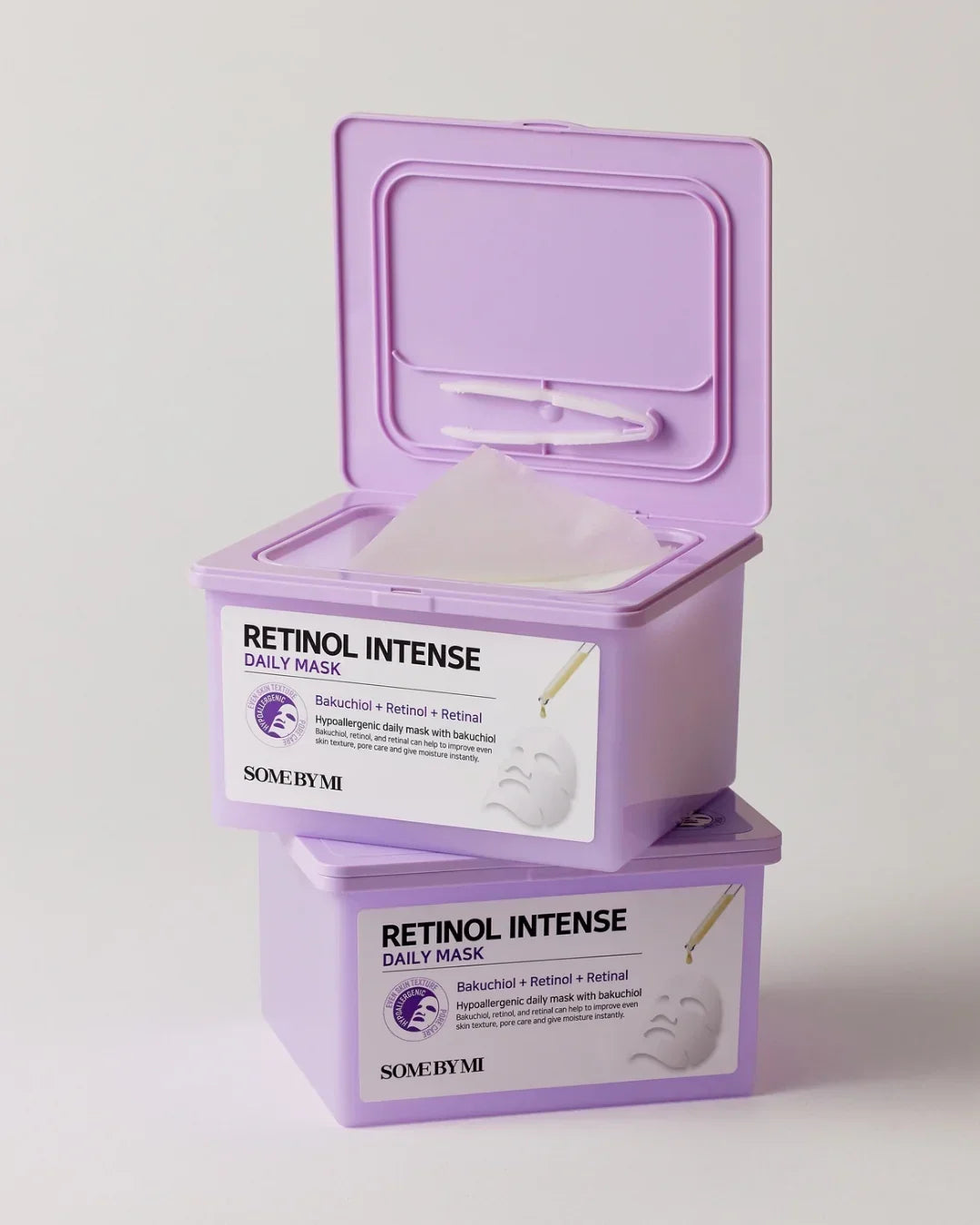 Two purple containers of Retinol Intense Daily Mask by Some By Mi, one open with a visible sheet mask