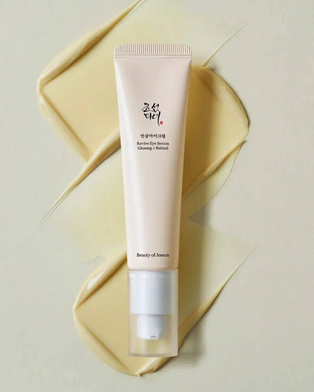 Beauty of Joseon Revive Eye Serum with Ginseng and Retinal in a beige tube on creamy background