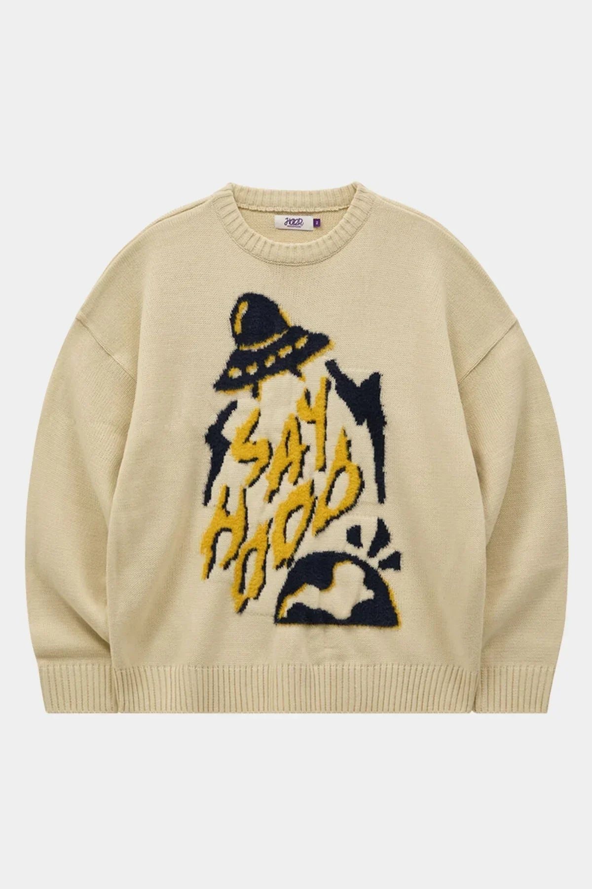 Ivory knit sweater with black and yellow UFO and 'Say Hood' graphic design on front