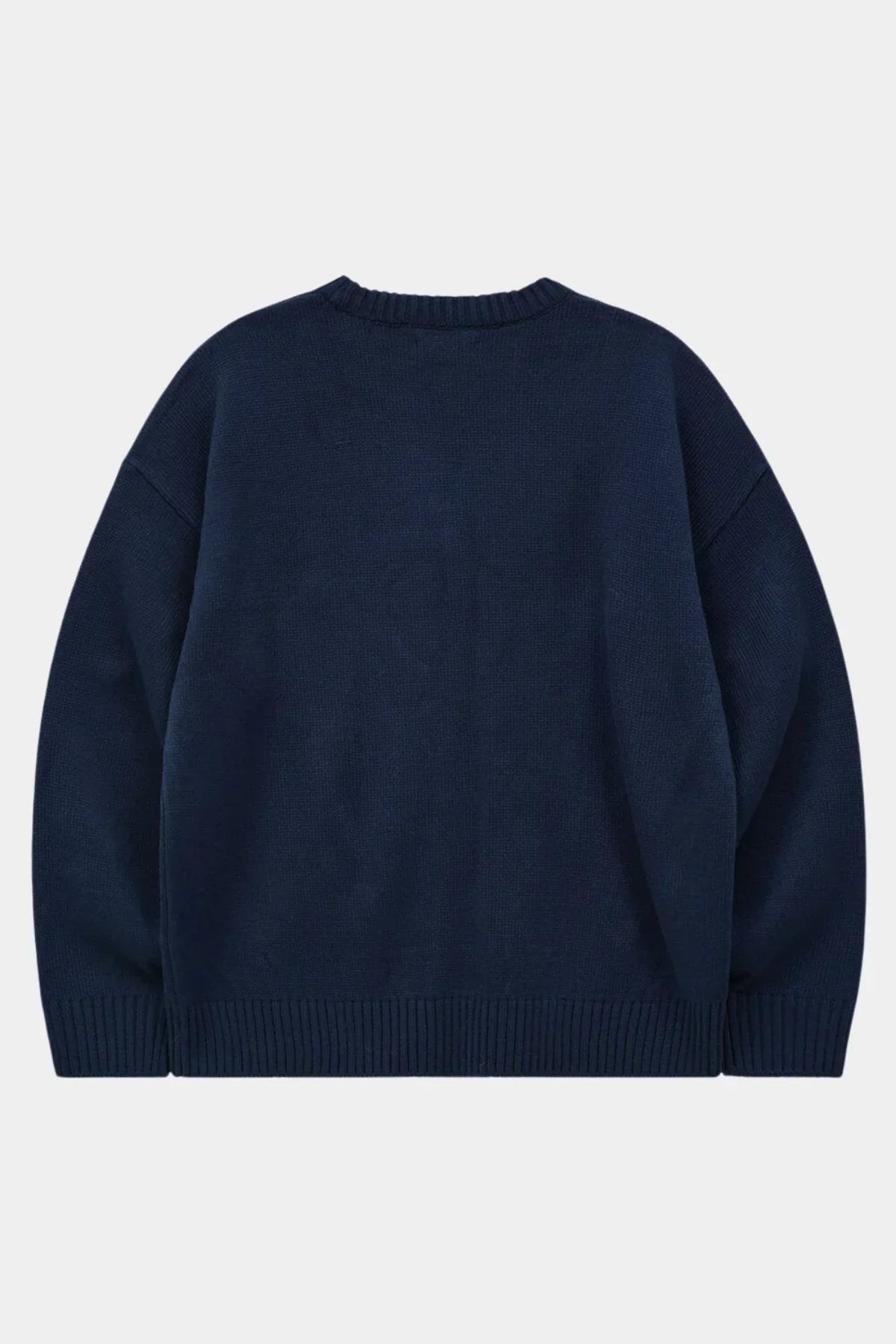 Back view of navy blue ribbed knit sweater with long sleeves on light background