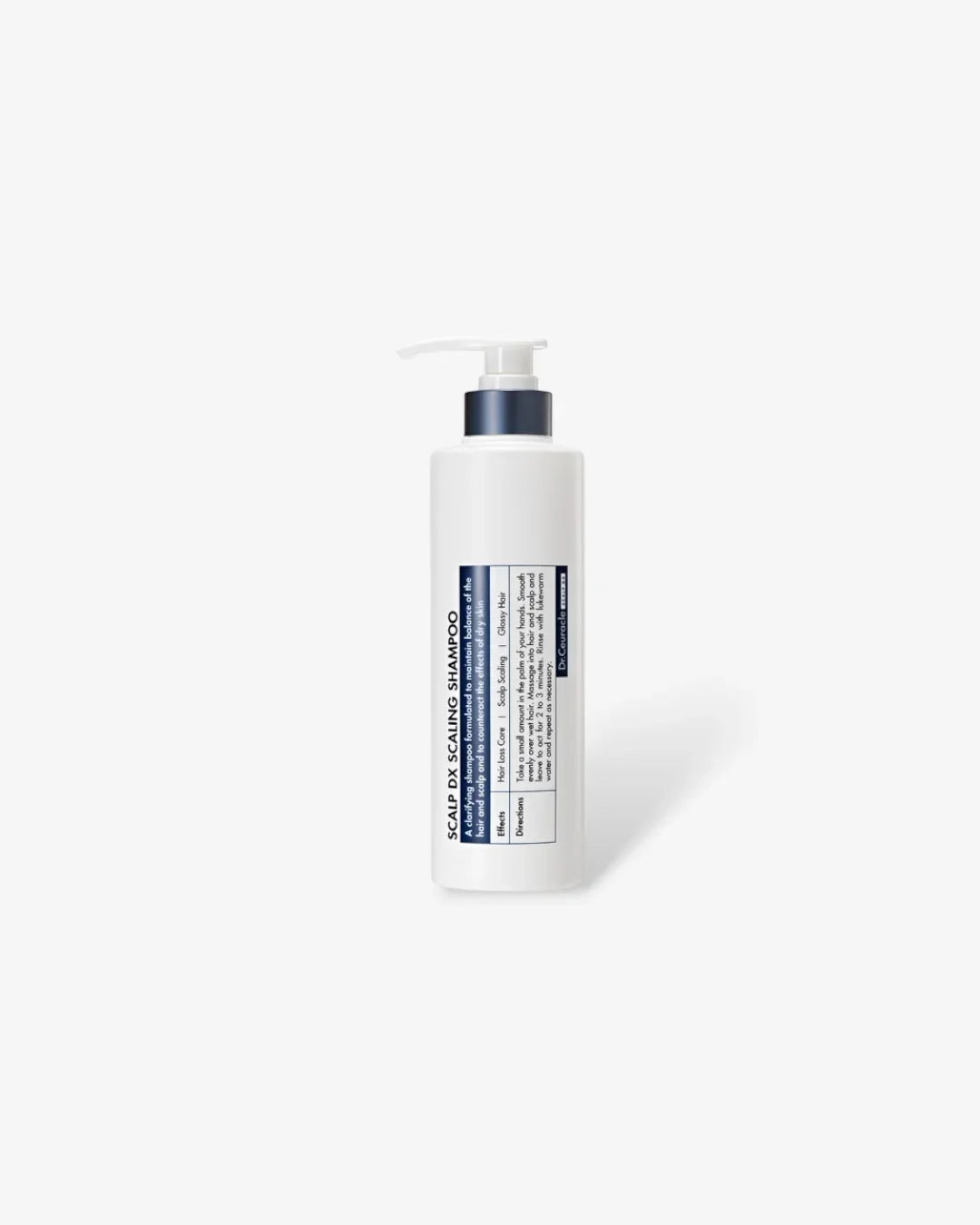 White bottle of Scalp DX Scaling Shampoo with pump dispenser and blue label on white background