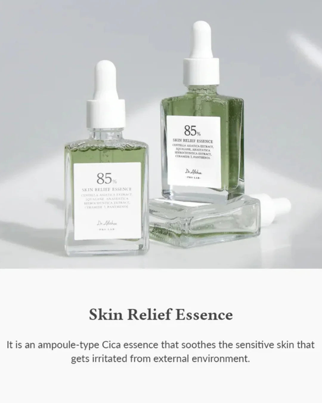Two bottles of 85% Skin Relief Essence with white droppers and green liquid, studio background