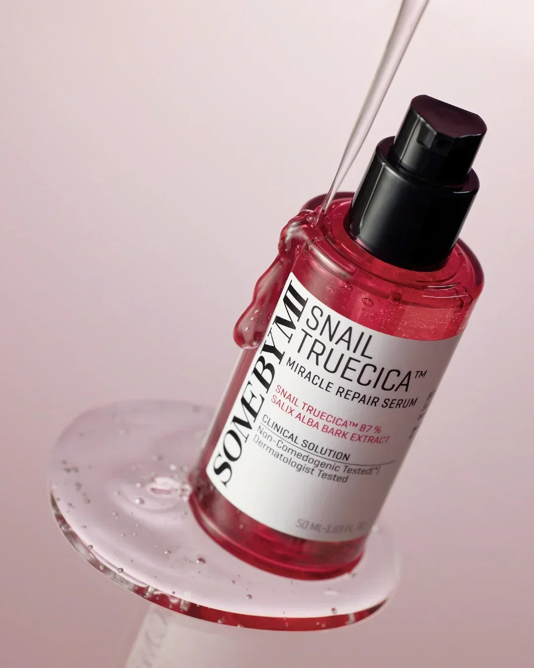 Some By Mi Snail Truecica Miracle Repair Serum bottle with clear gel on clear stand