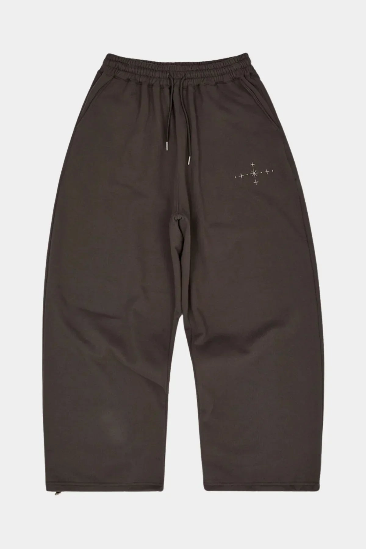 Charcoal sweatpants with elastic waistband, drawstring, side pockets, and star applique embroidery