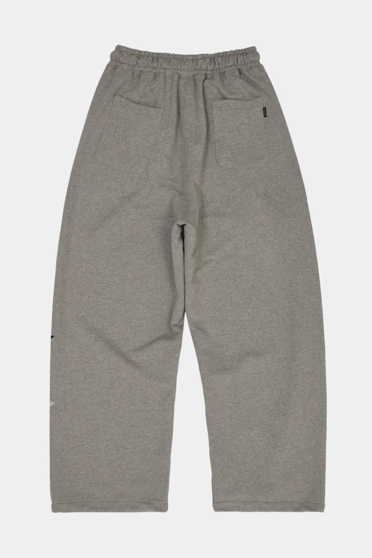 Back view of grey star print sweatpants with elastic waistband and patch pockets