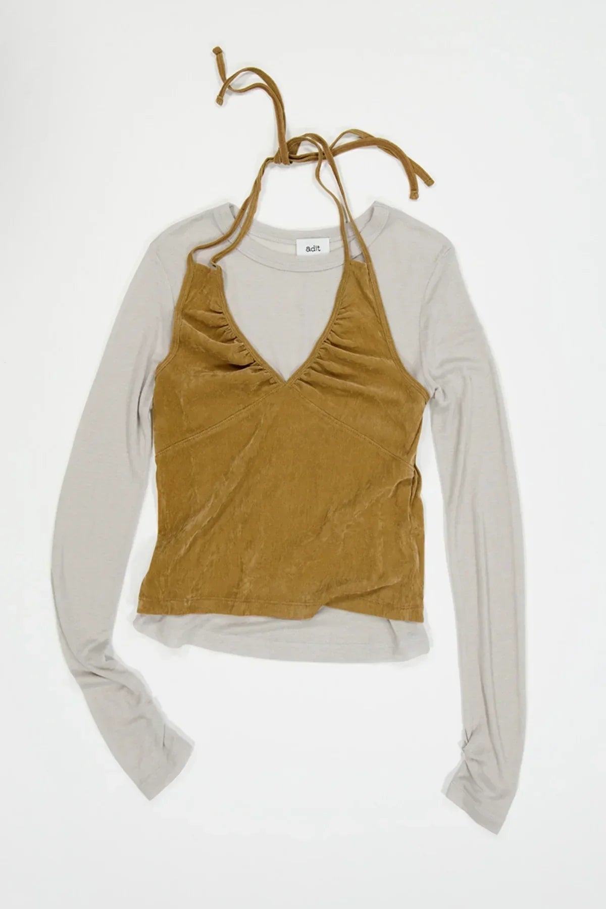 Camel suede shirring bra top layered over light gray long sleeve shirt on white background