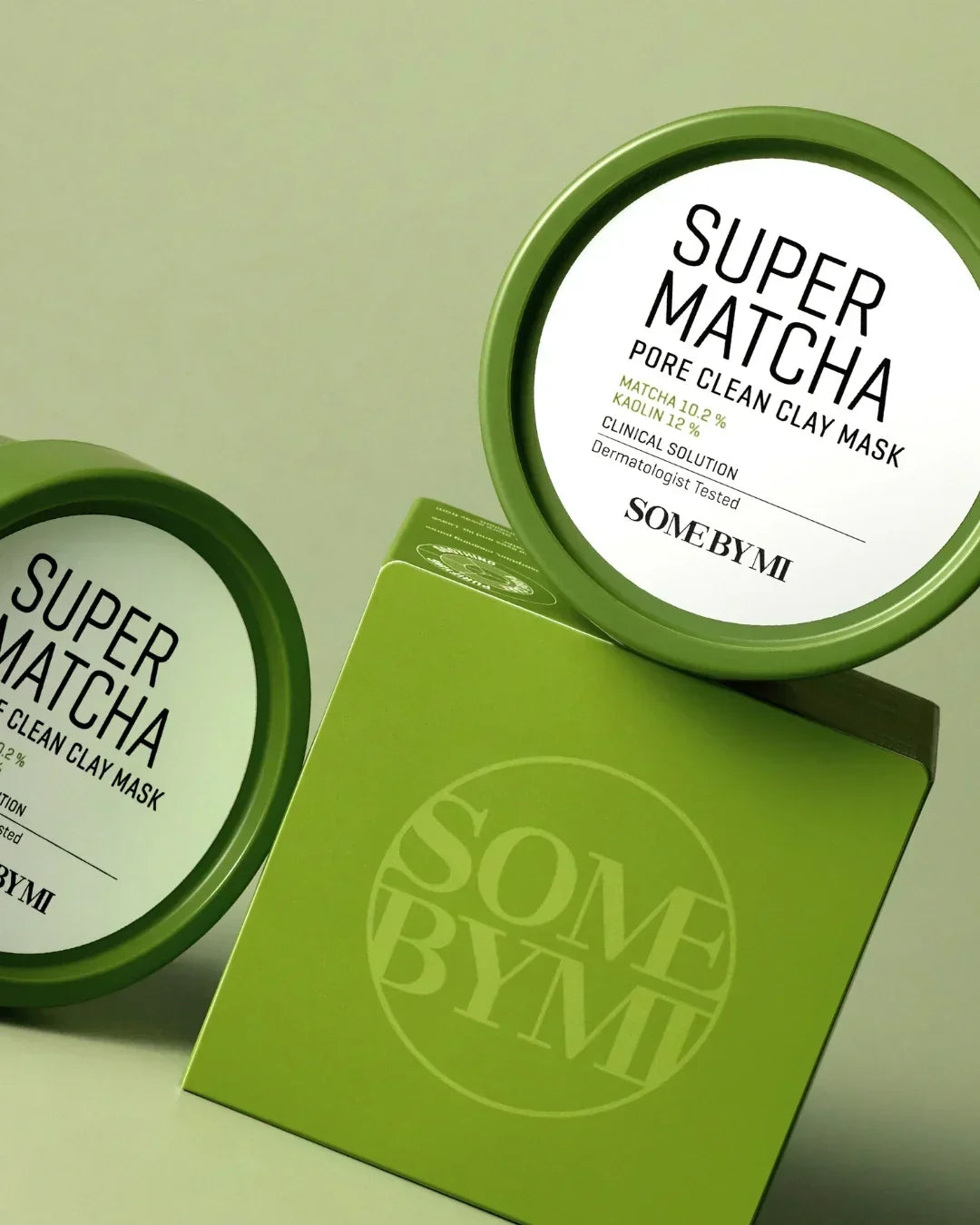 Green Super Matcha pore clean clay mask containers and box by SOMEBYMI on green background