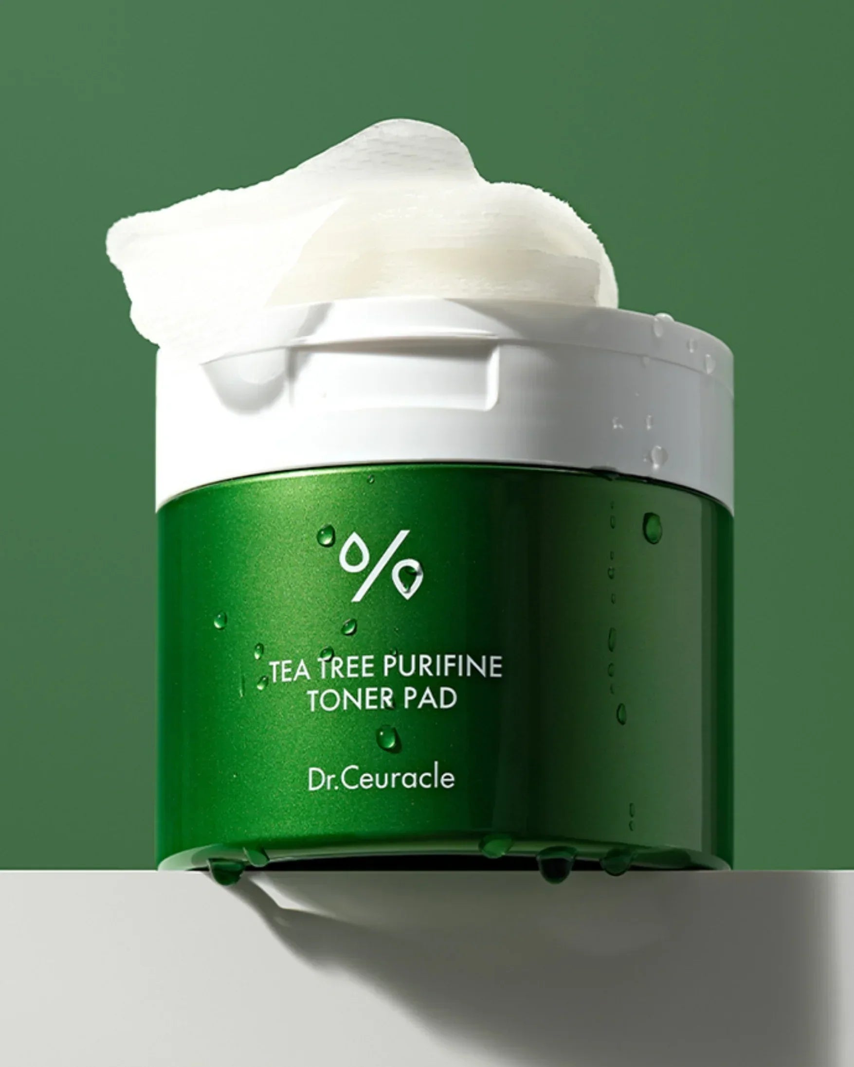 Dr.Ceuracle Tea Tree Purifine Toner Pad green container with white lid and toner pads on top