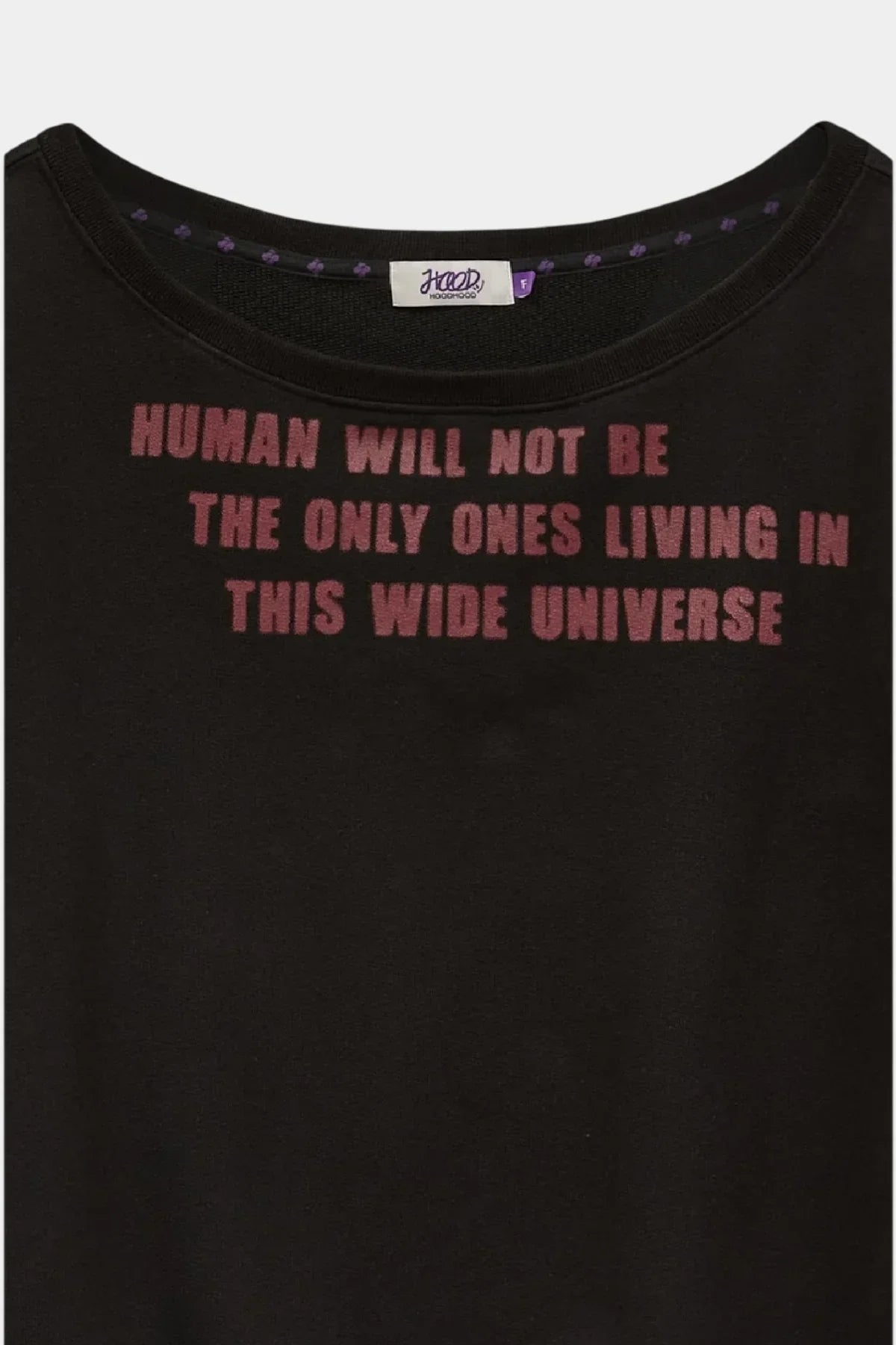 Black sweatshirt with red lettering reading "HUMAN WILL NOT BE THE ONLY ONES LIVING IN THIS WIDE UNIVERSE" and round neckline