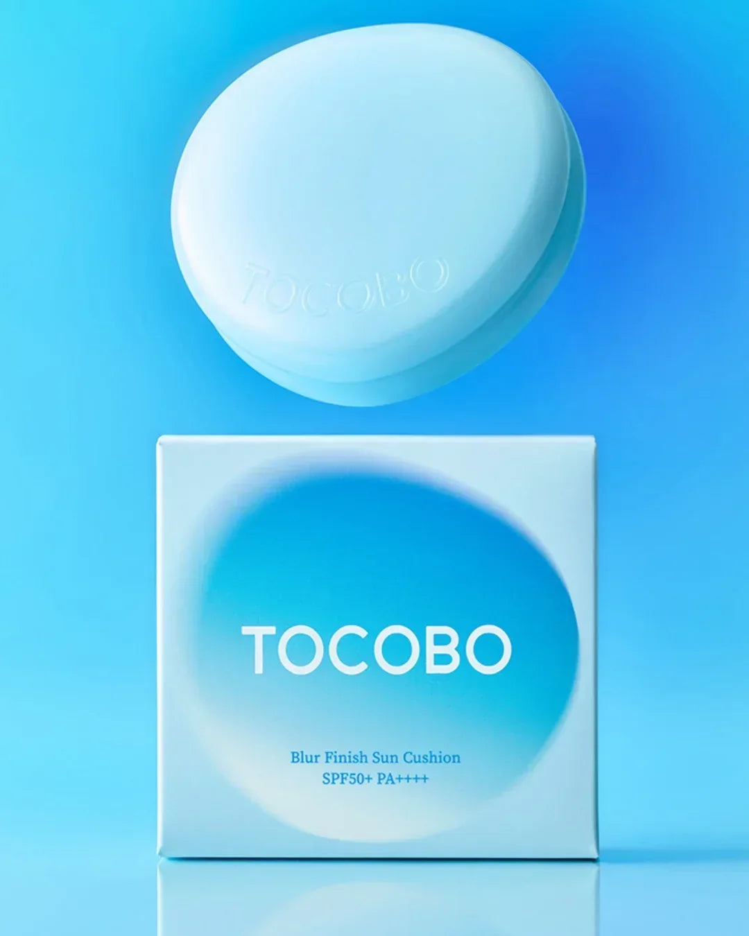 TOCOBO Blur Finish Sun Cushion SPF50+ PA++++ compact and packaging on blue background