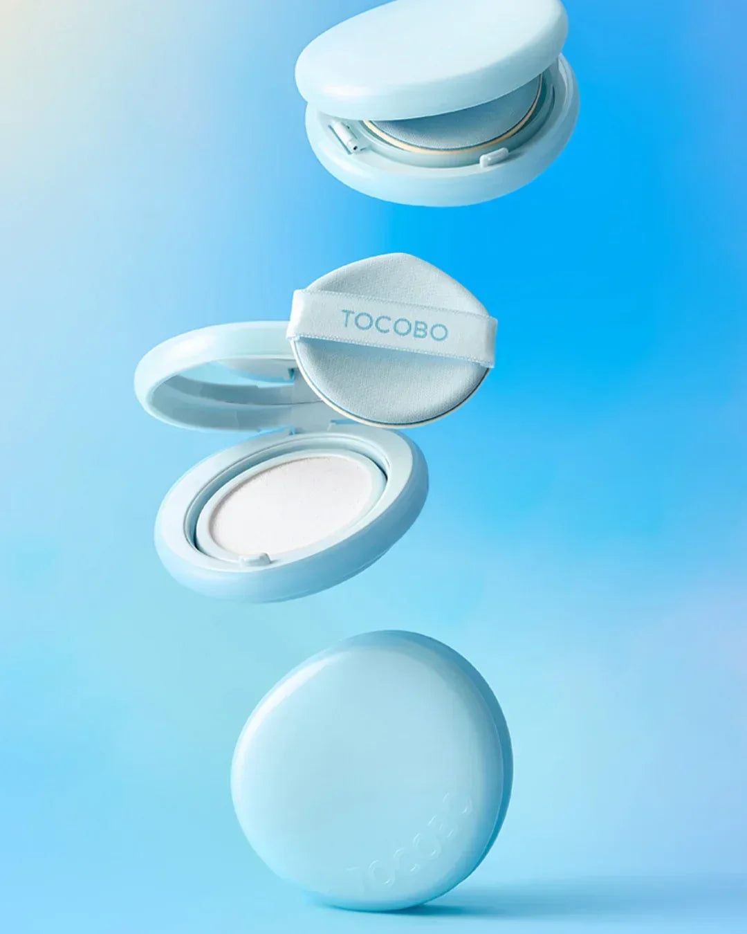Tocobo Blur Finish Sun Cushion compact with applicator puff on blue gradient background