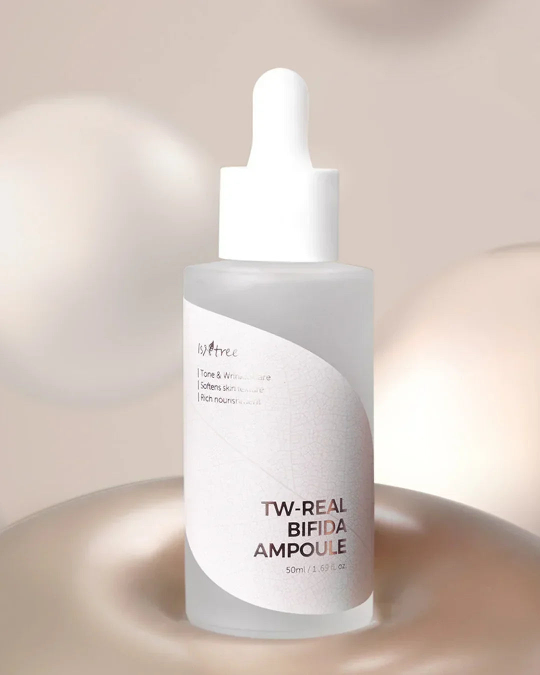 TW-REAL BIFIDA AMPOULE skincare serum bottle with white dropper on beige background