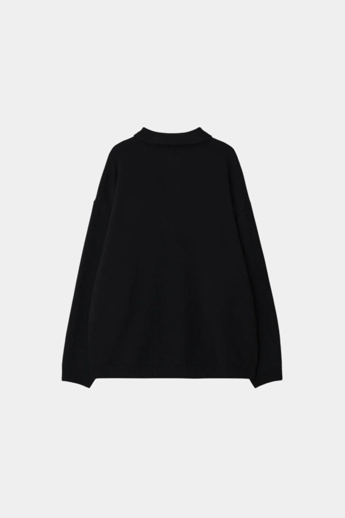 Back view of a black unisex knit Henley neck long-sleeve shirt on a light background