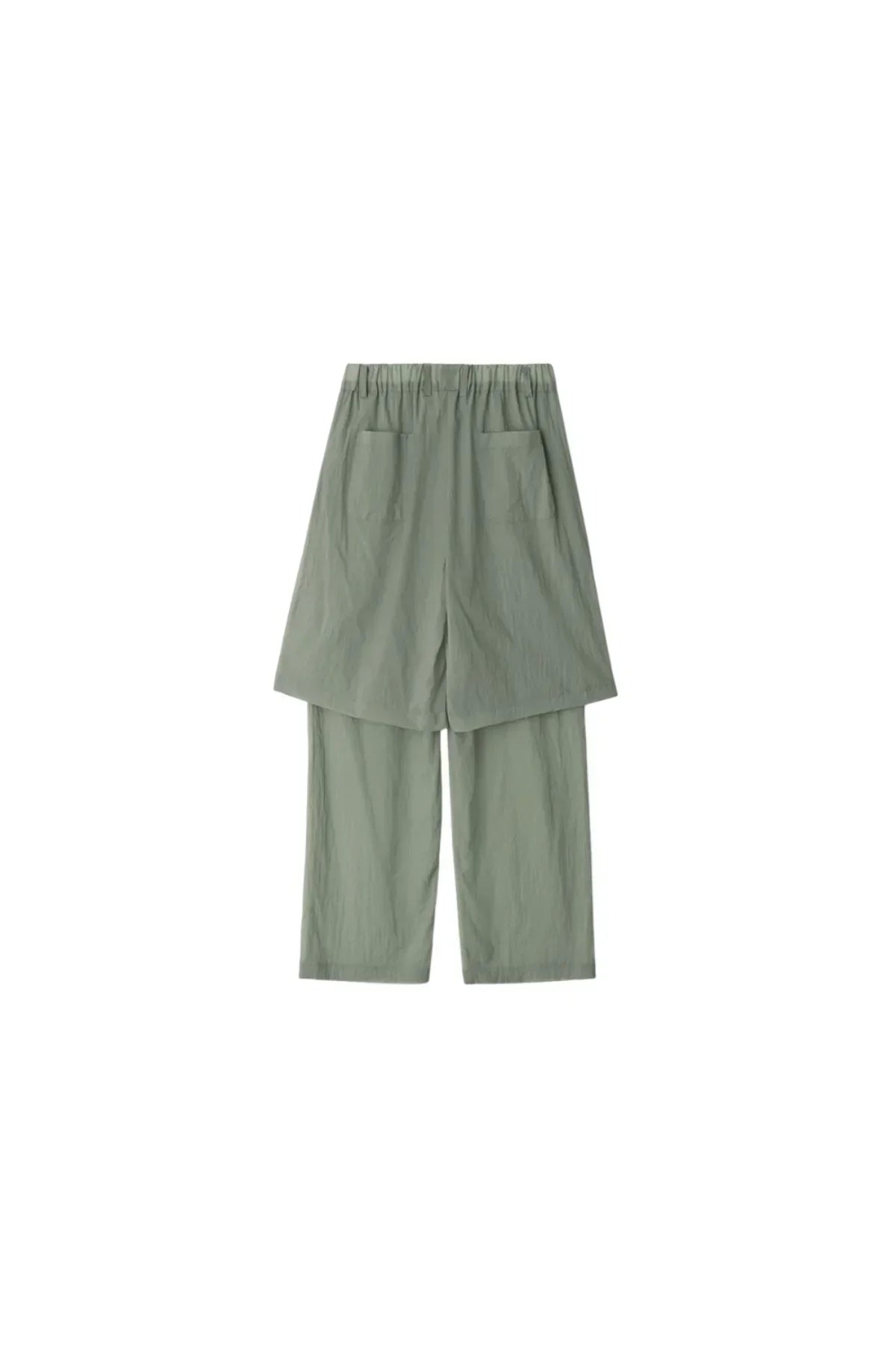 Back view of unisex layered mint green pants with elastic waistband and pockets