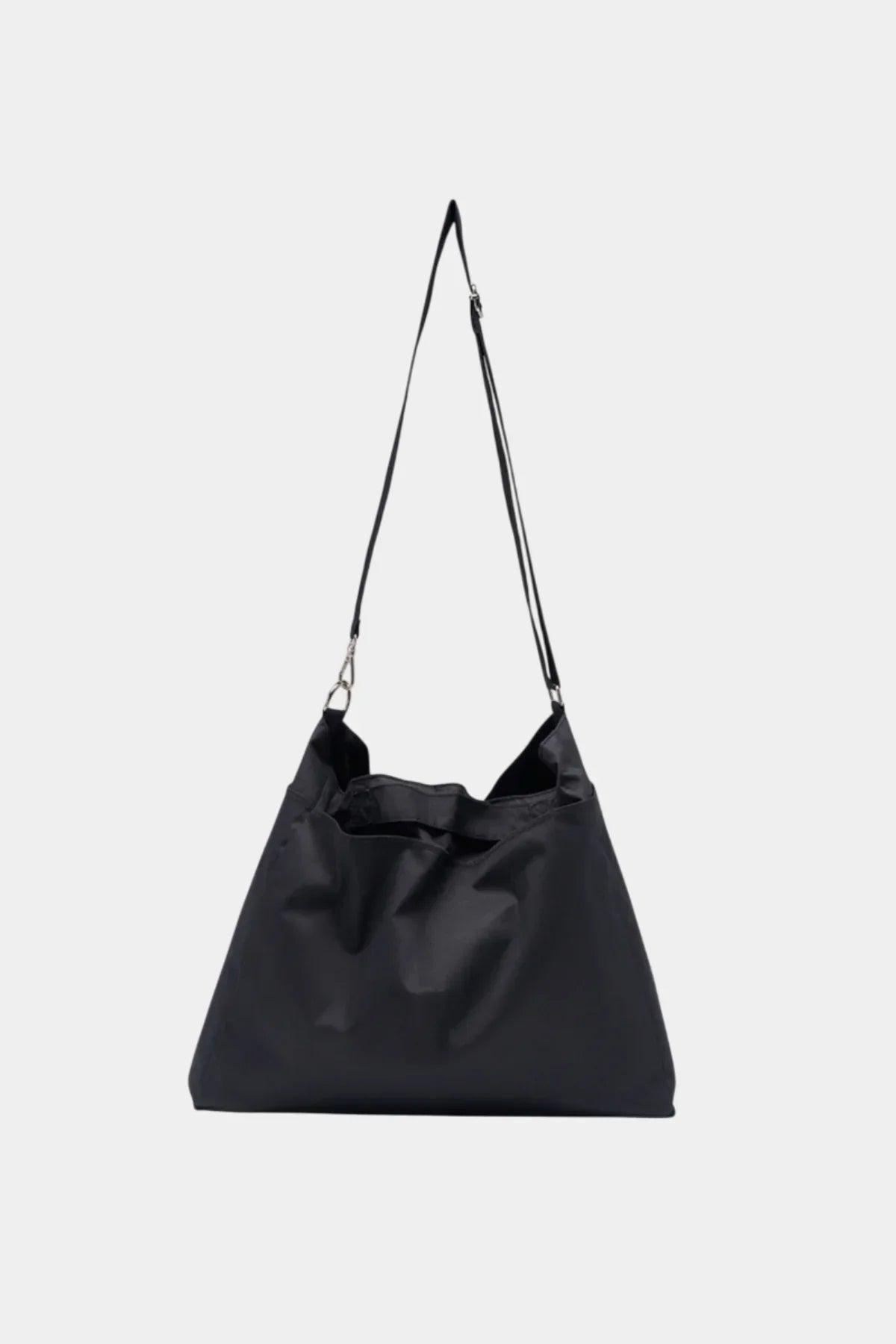 Unisex black shoulder bag with adjustable strap on white background