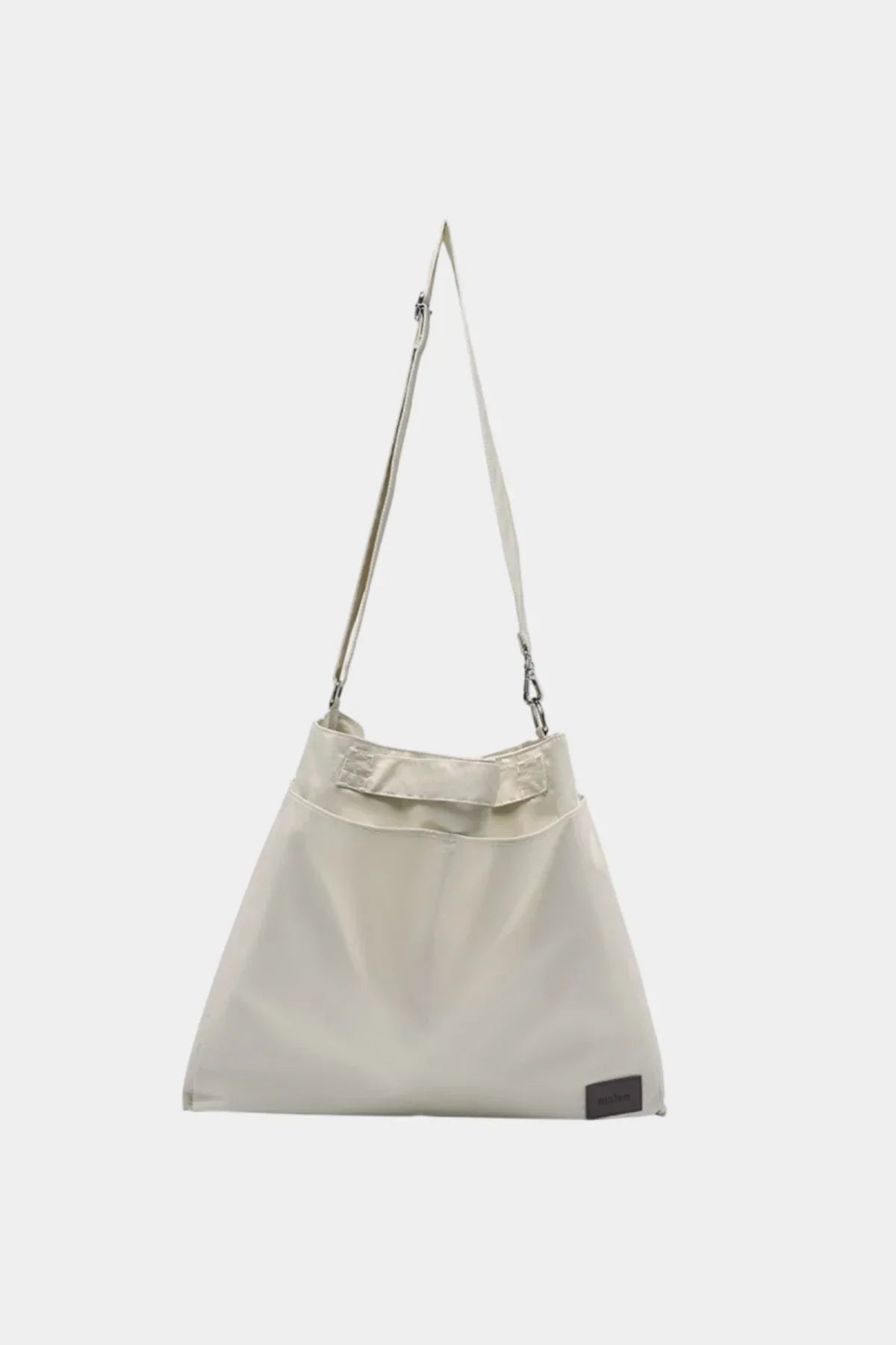 Cream unisex shoulder bag with adjustable strap and minimalist design on white background