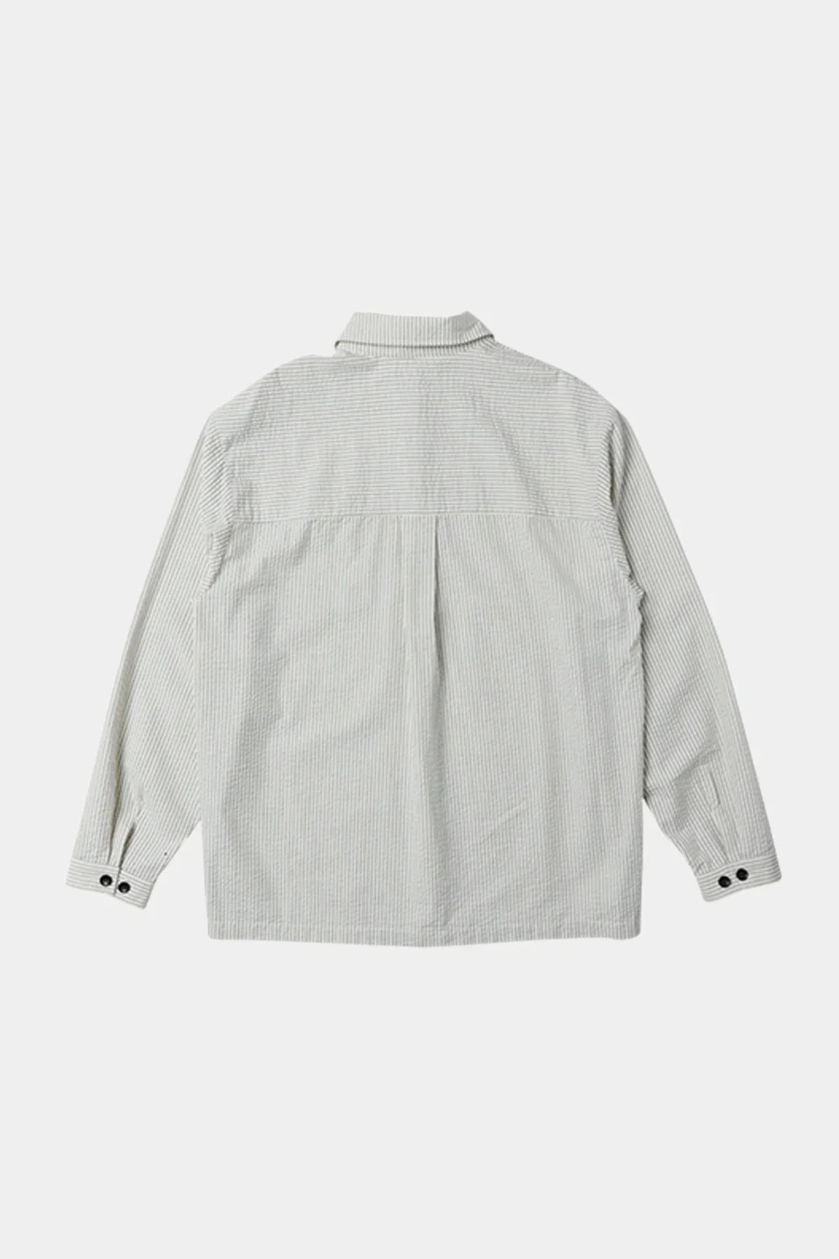 Back view of unisex long sleeve shirt with thin vertical navy stripes and buttoned cuffs