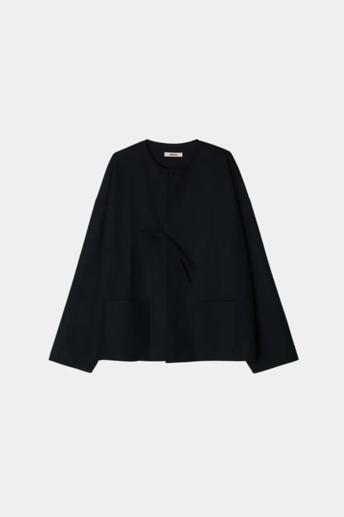 Black unisex wool loop jacket with round neckline and front pockets on white background