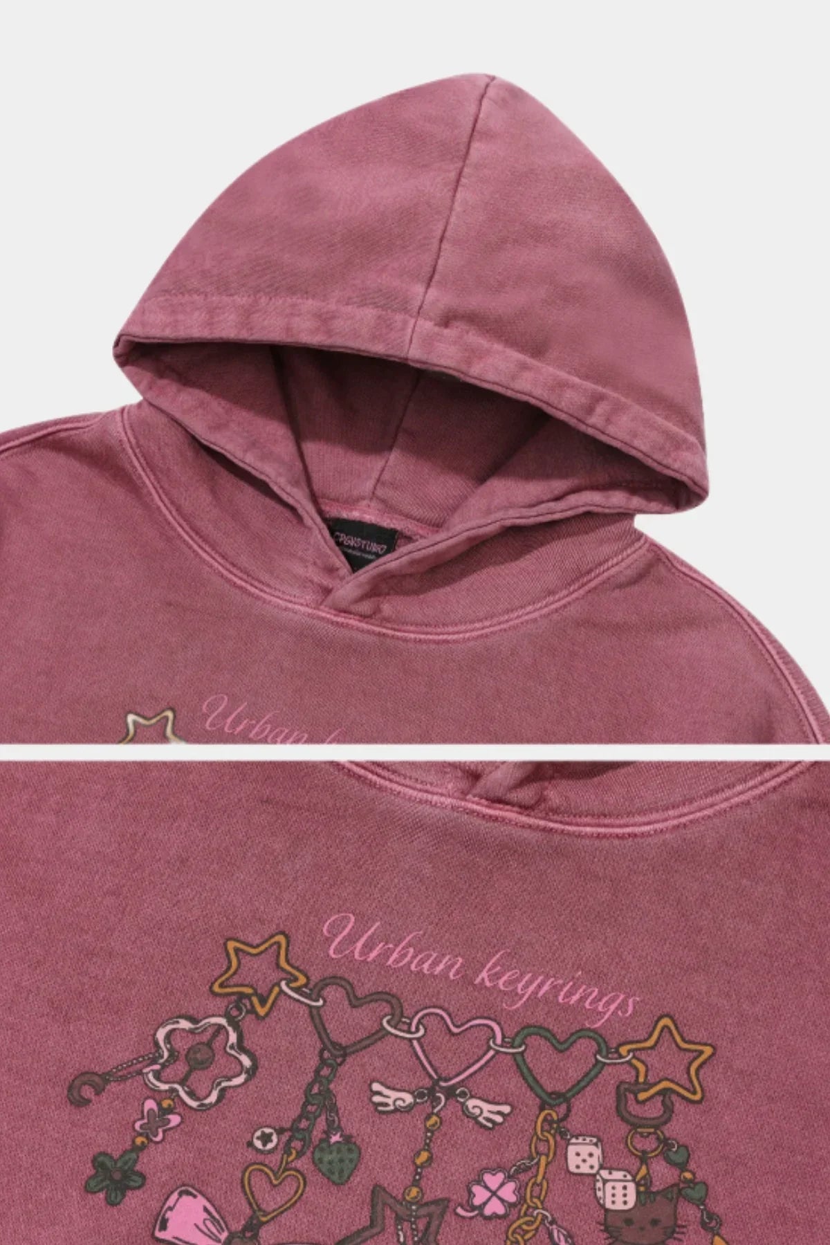 Dusty pink pigment hoodie with Urban Keyrings graphic featuring hearts, stars, and charm illustrations