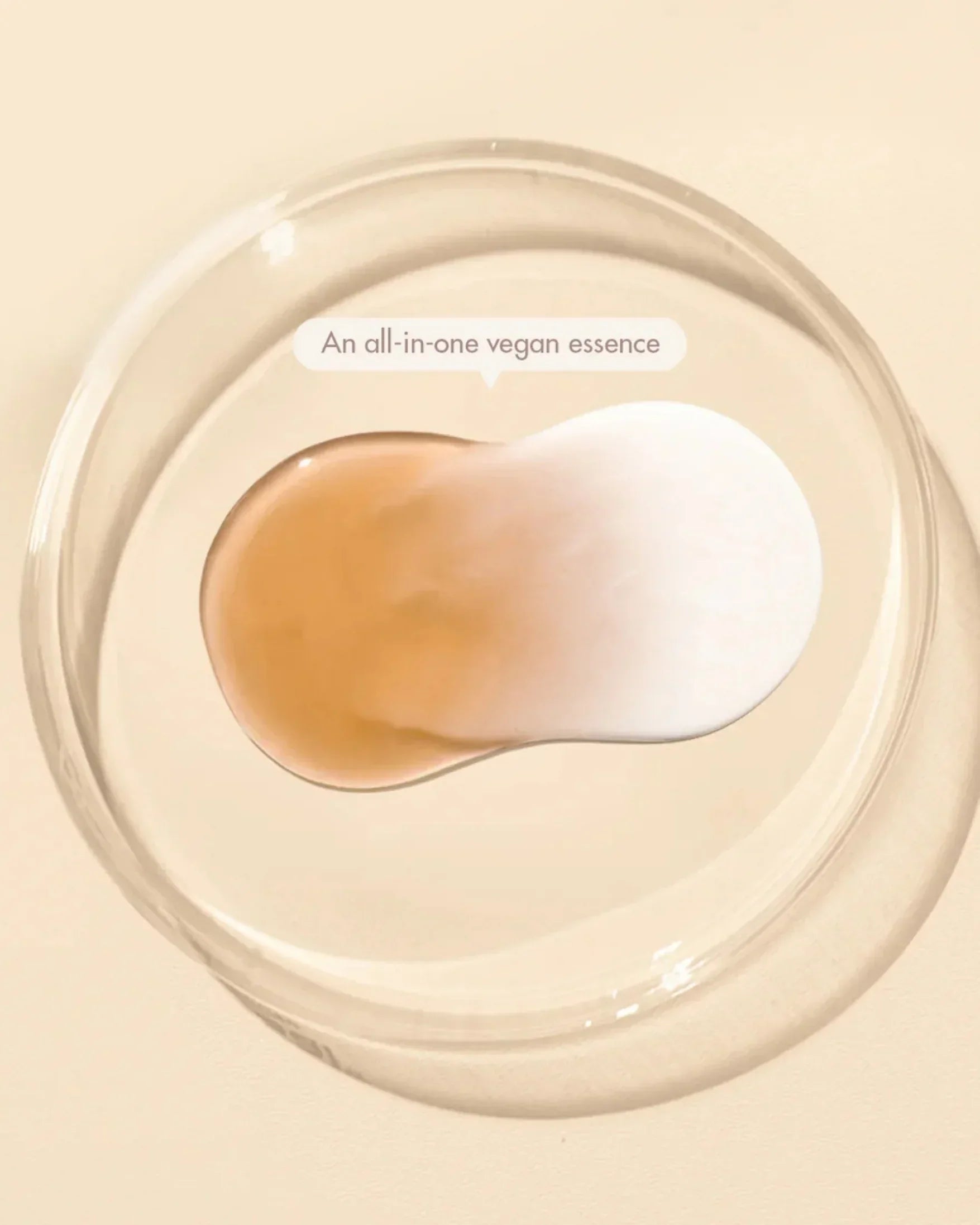 Brown and white vegan essence liquid drops in a clear glass petri dish on beige background
