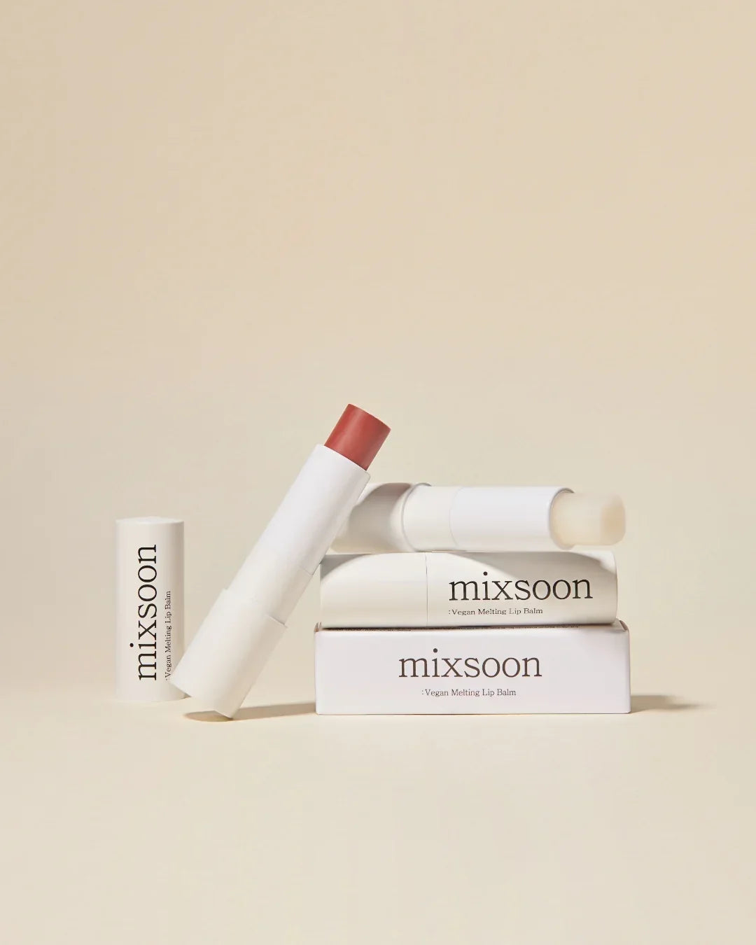 Mixsoon vegan melting lip balm in white packaging with one tinted and one clear balm on beige background