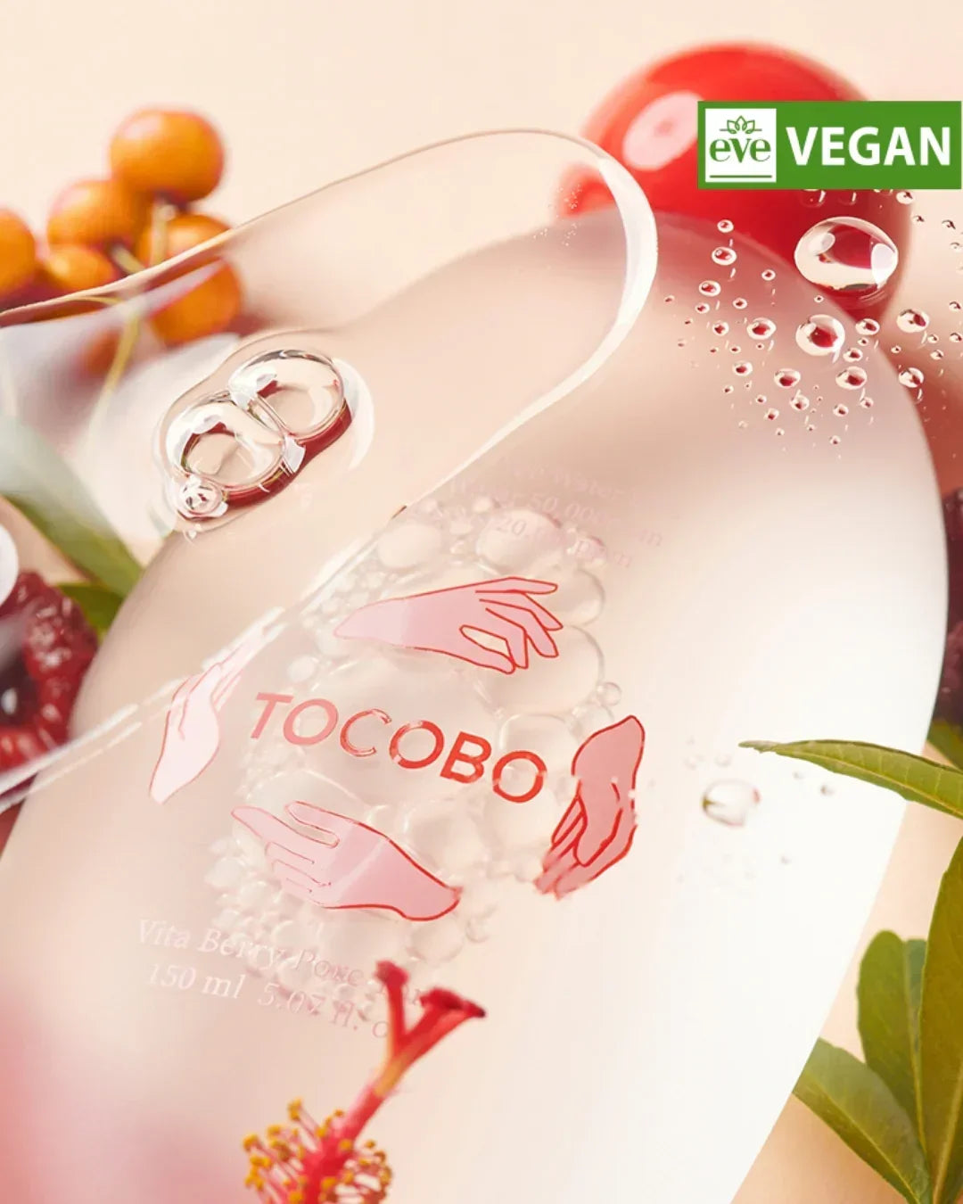 Close-up of Tocobo Vita Berry Pore Toner bottle with vegan label, clear liquid, and berry decor