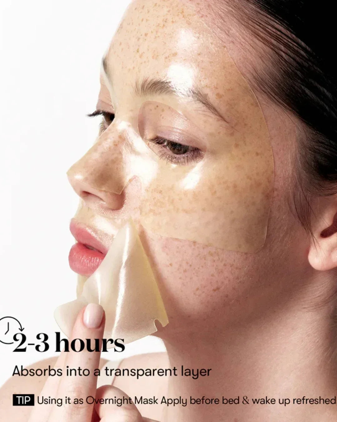 Woman applying transparent Vitalight Reedle 2-step facial mask on freckled skin for overnight skincare