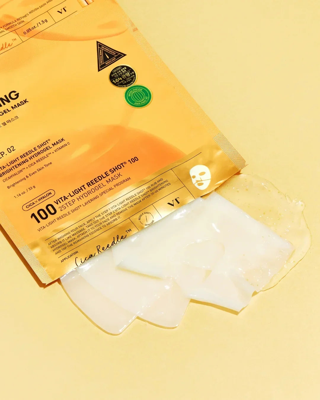 100 Vita-Light Reedle Shot 2-step hydrogel face mask in yellow packaging with translucent gel mask pieces