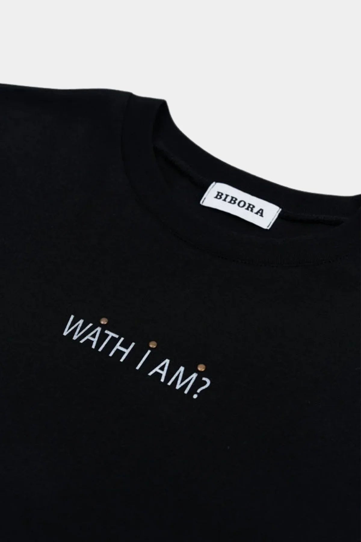 Black long sleeve T-shirt with white text 'WATH I AM?' and Bibora brand label on collar