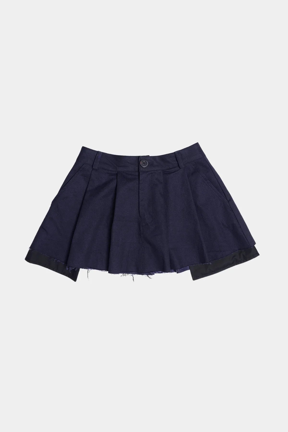 Navy wide tuck mini skirt with pleats and frayed hem on white background