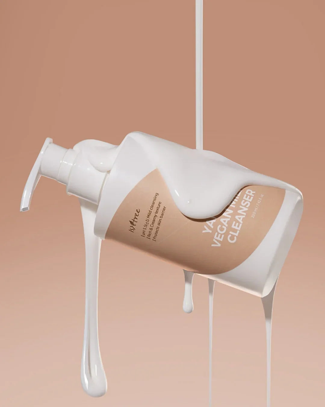 Isntree Yam Root Vegan Milk Cleanser bottle with cream texture on beige background