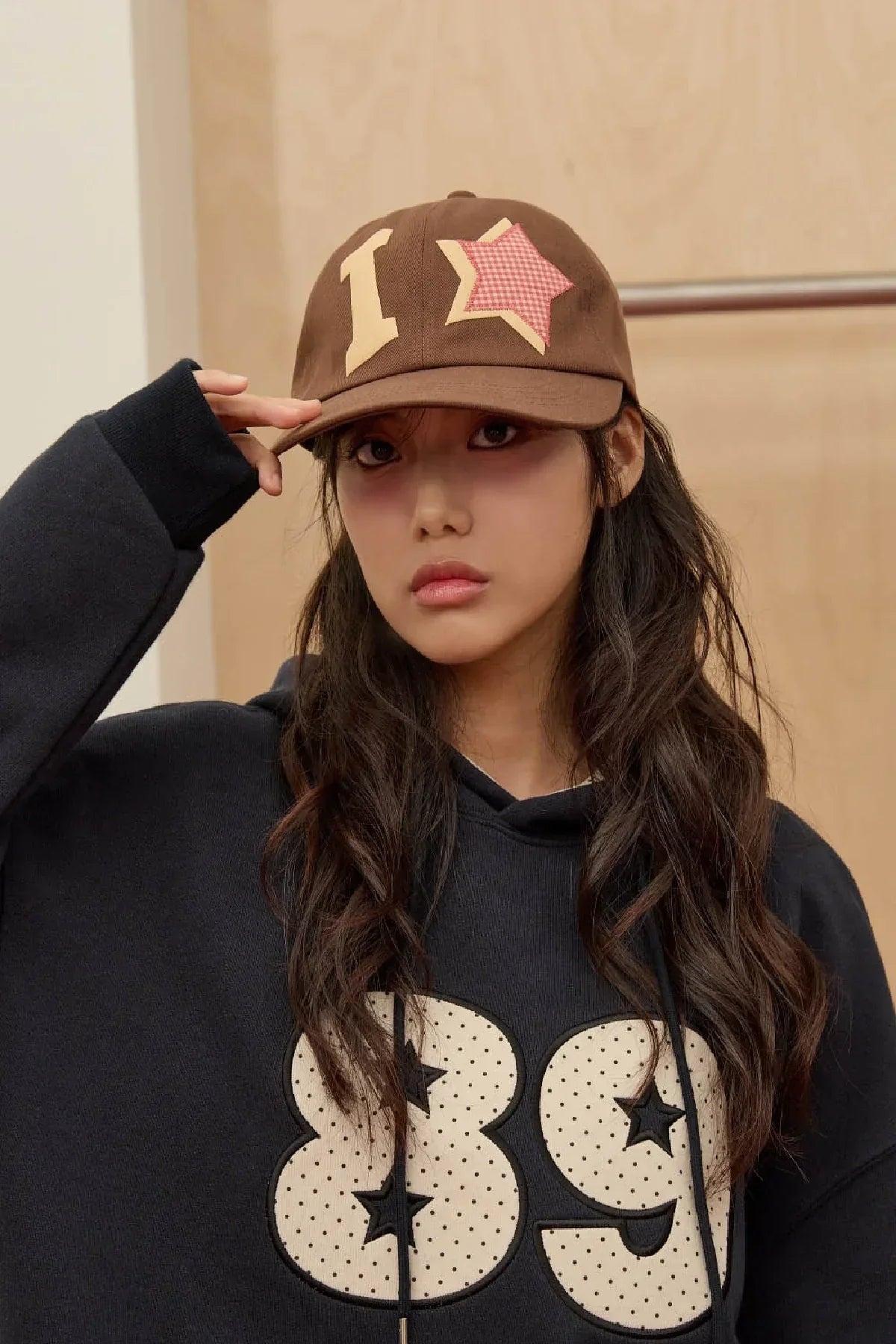 Model wearing a brown check applique ball cap with star patch, styled in Korean fashion, Malkn