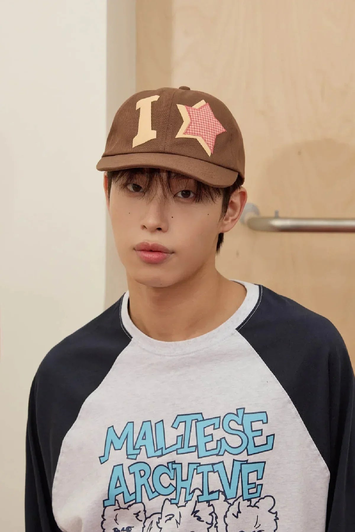 Brown check applique ball cap with star detail, Korean fashion, modeled indoors by Malkn