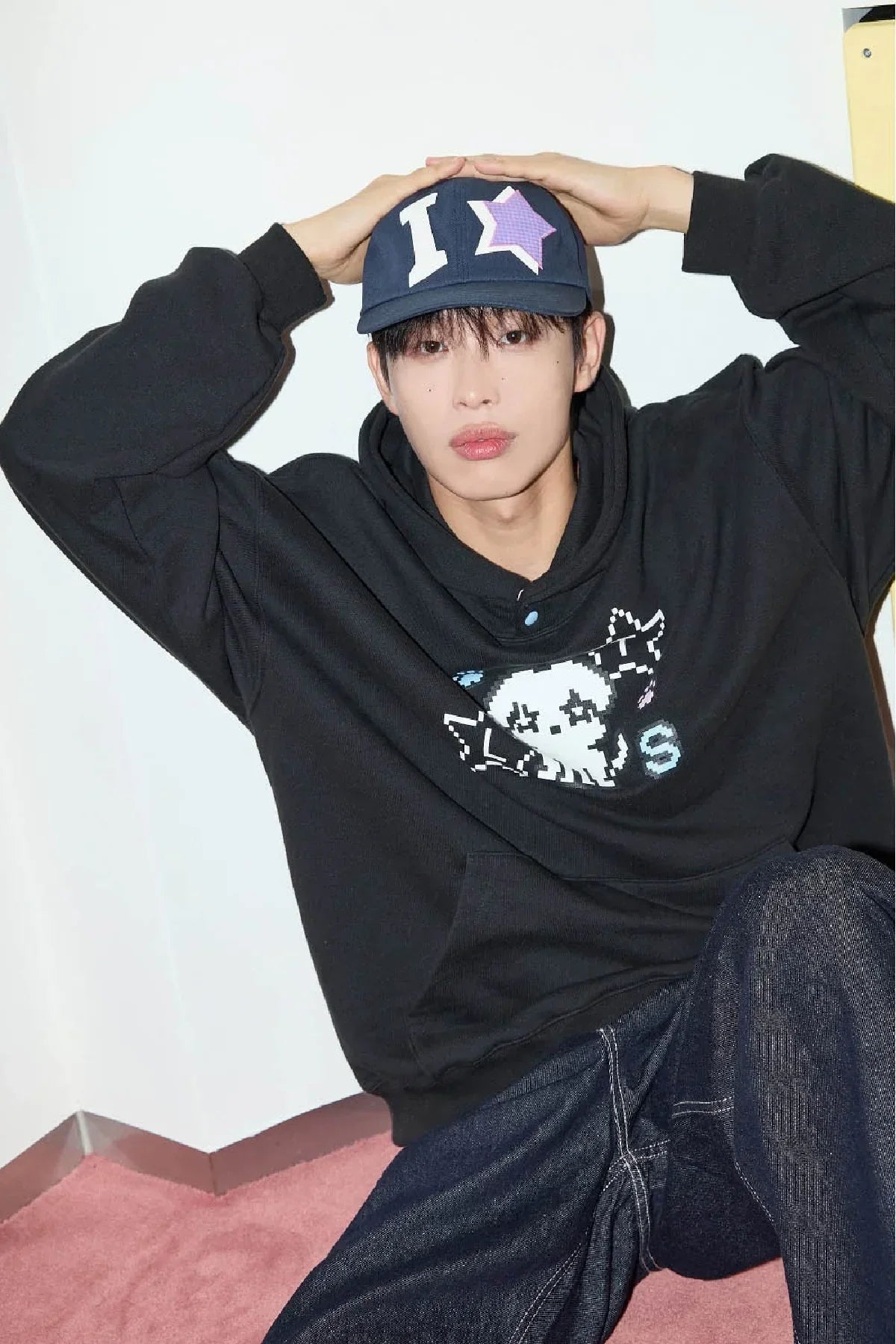Model in Korean streetwear, navy ball cap with star applique, black hoodie, Malkn fashion.
