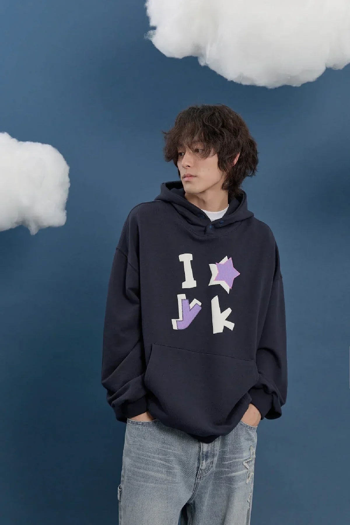 Model wearing navy Korean streetwear hoodie with bold applique details, Malkn lifestyle fashion