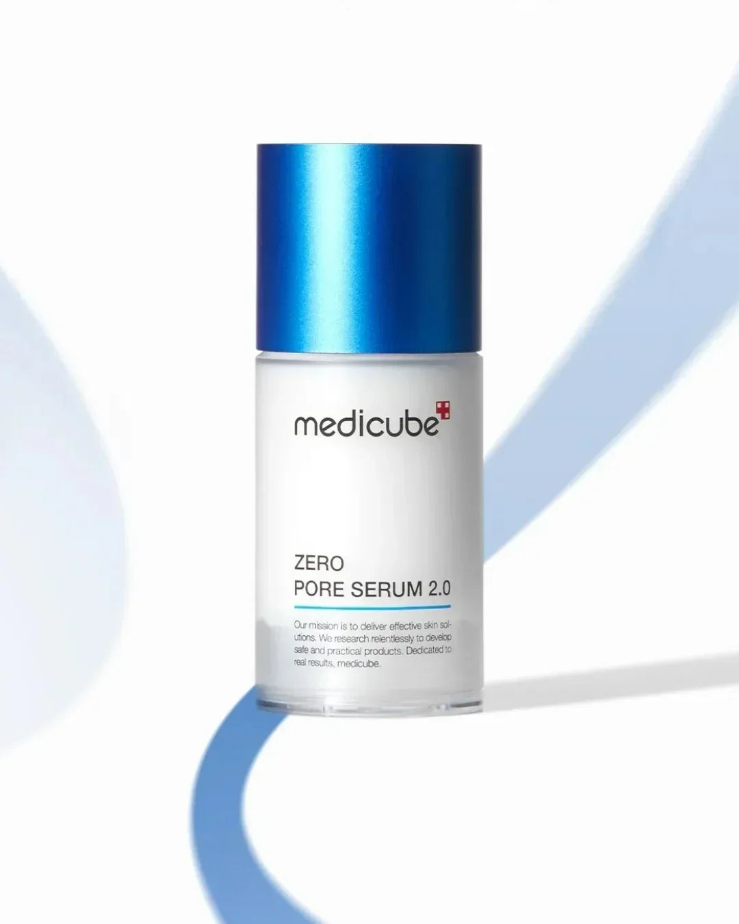 Medicube Zero Pore Serum 2.0 bottle with blue cap on white background with blue curved shadow