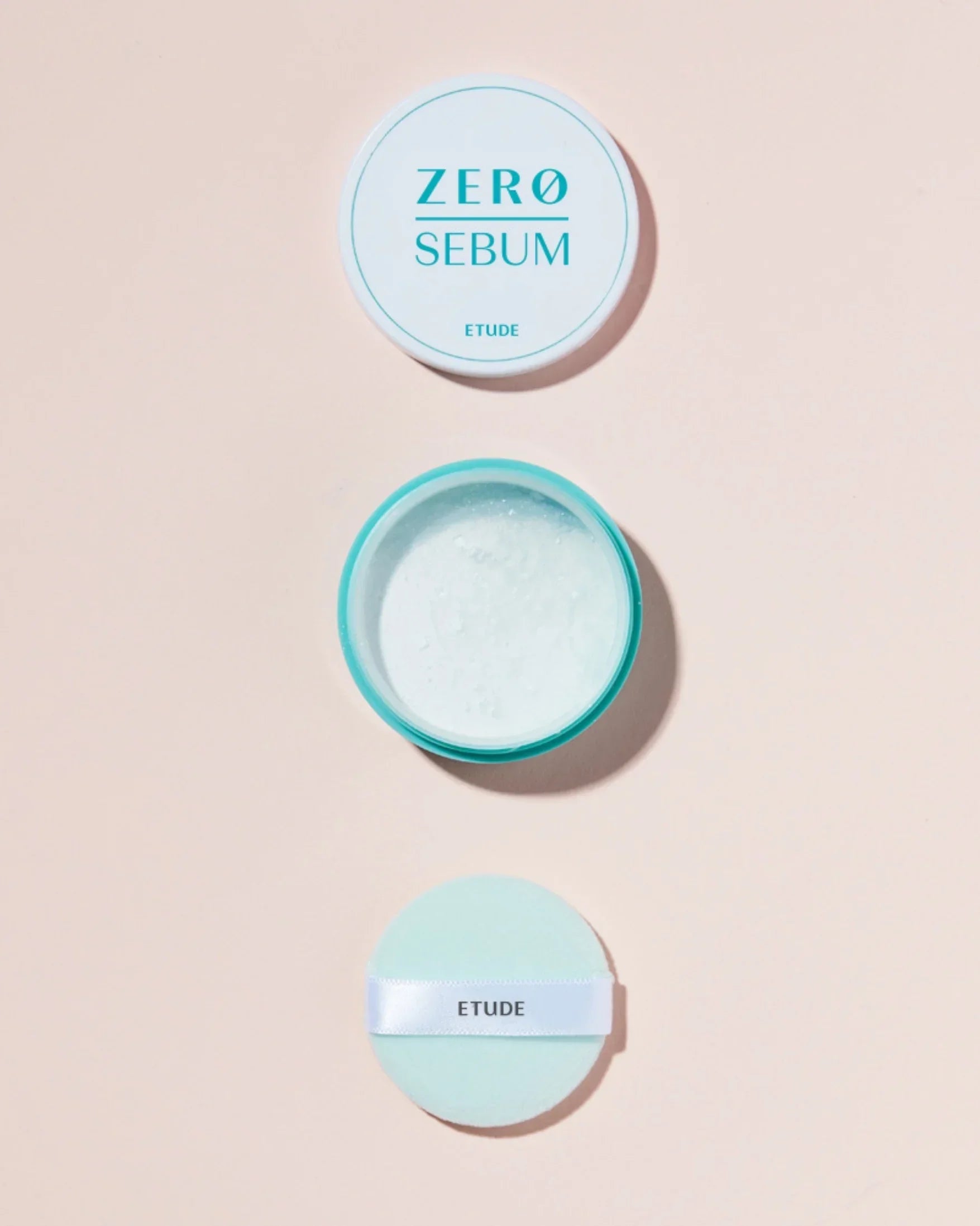 Etude Zero Sebum drying powder open container showing white powder with applicator puff on beige background